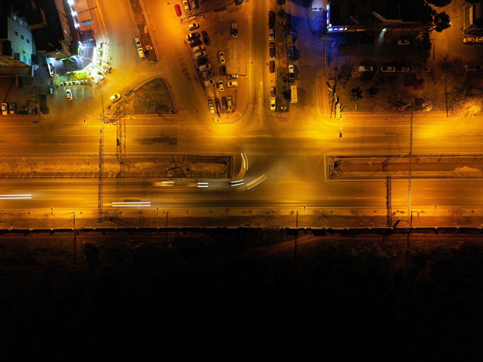 Aerial night view of streets and city lights