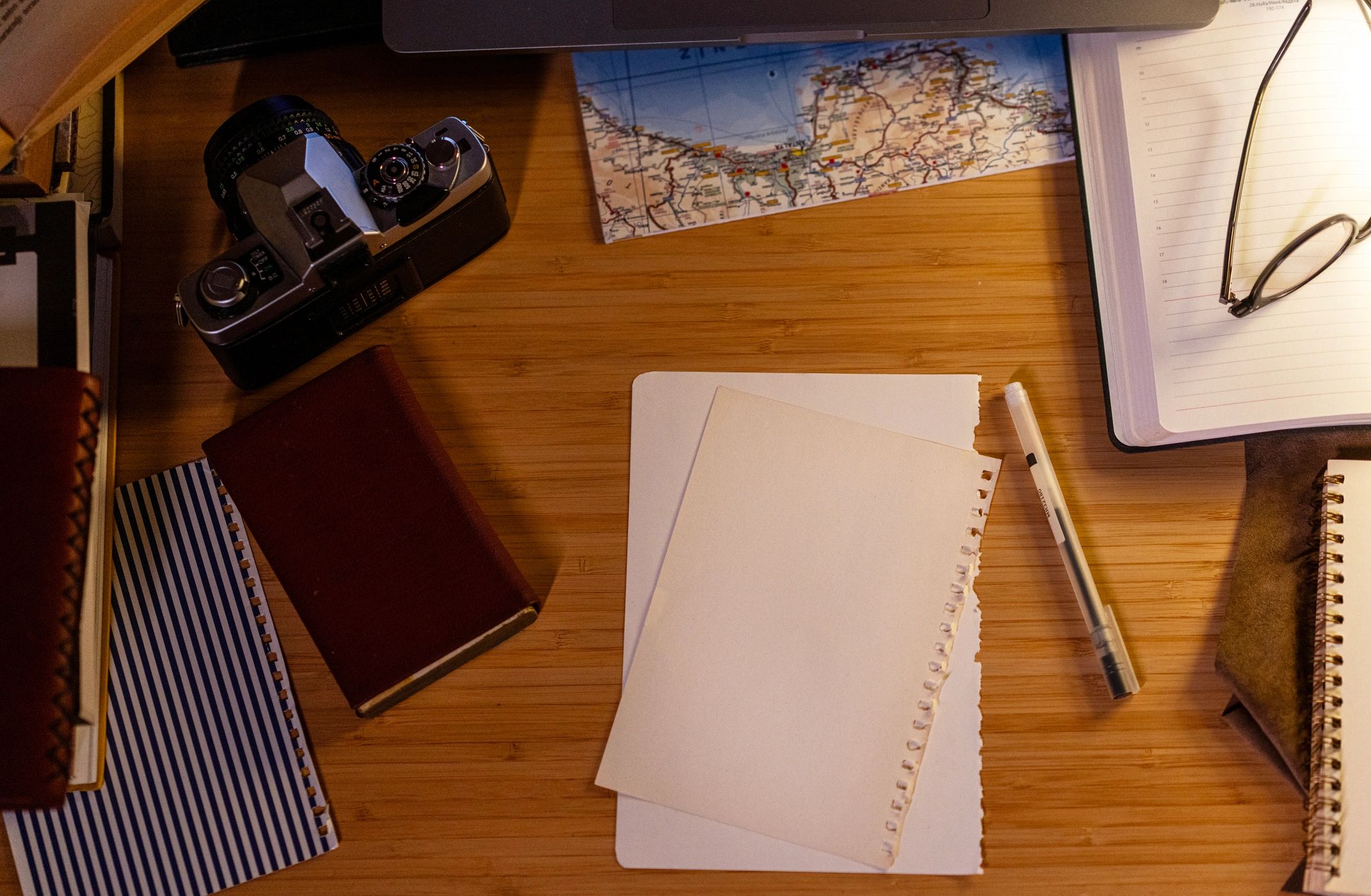 Planning desk with map and notes in low light