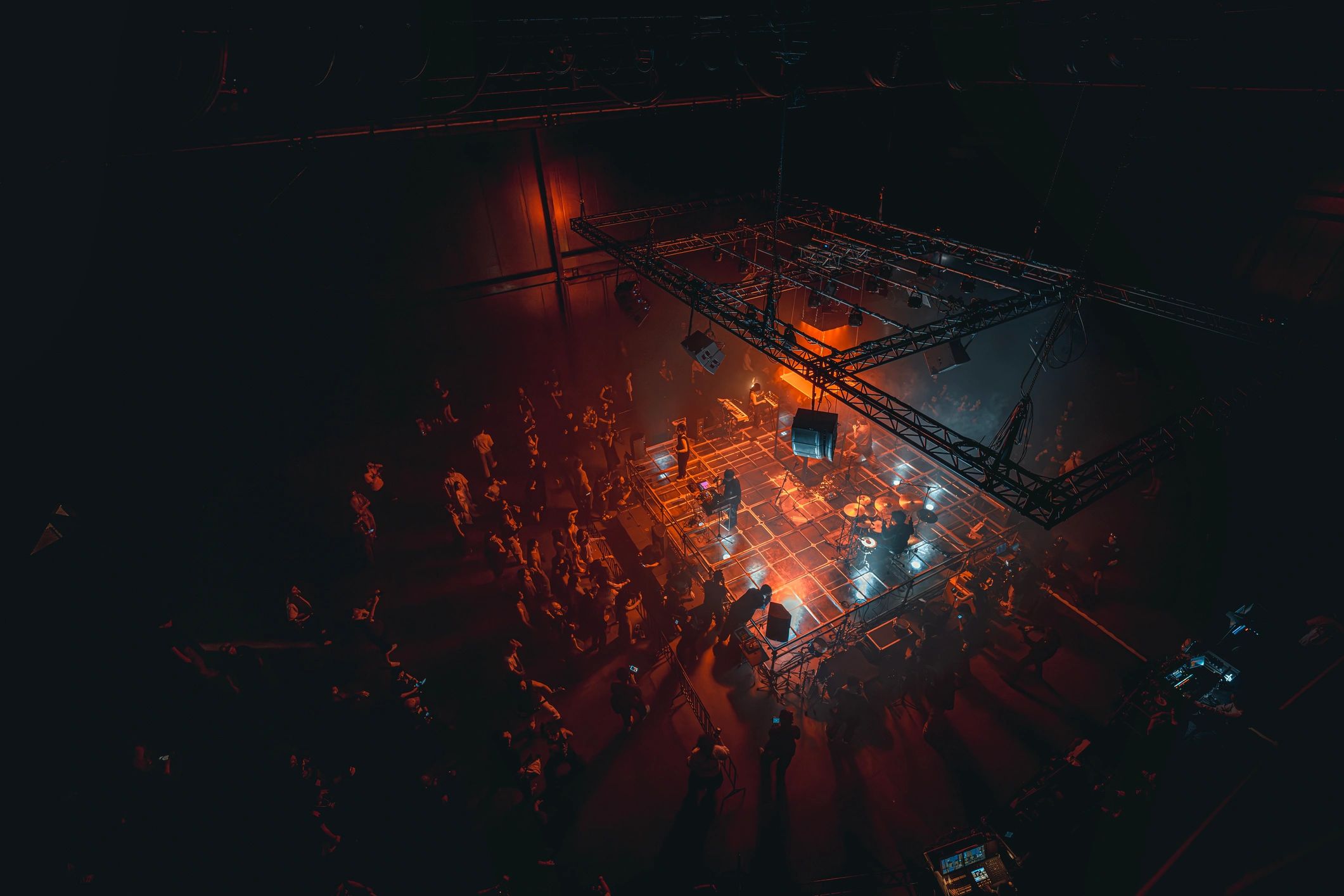Musicians performing on a lit stage at a festival